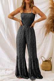Dusk Blue Floral Jumpsuit with spaghetti straps and wide-leg design on a model against a white backdrop.