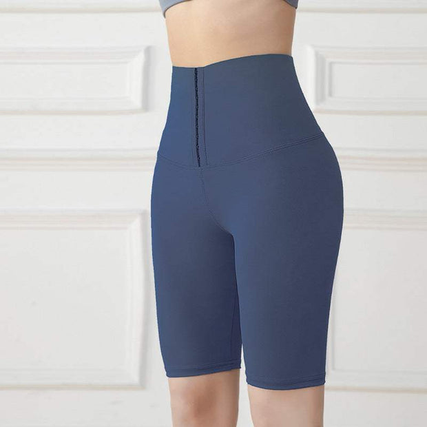 Navy blue Abdominal Hip Lift Yoga Pants with high-waisted design for support and flexibility.
