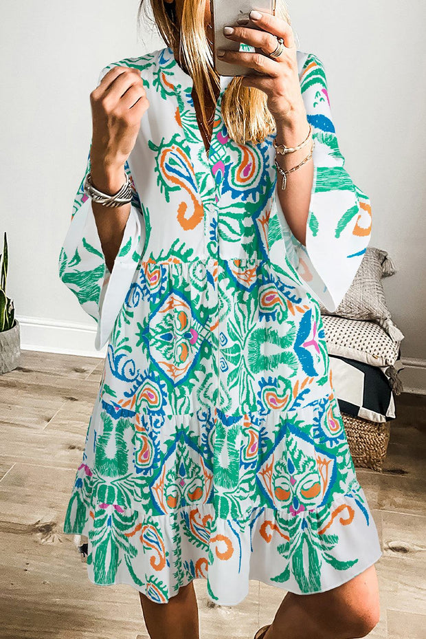 White boho print mini dress with colorful patterns, perfect for summer vibes.