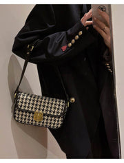 Houndstooth Baguette Bag with chic design and compact elegance.