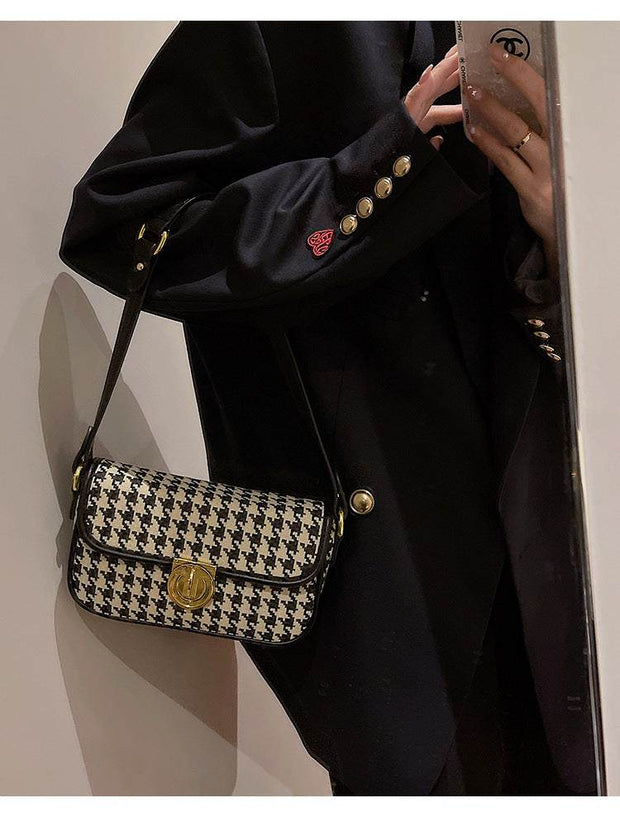 Houndstooth Baguette Bag with chic design and compact elegance.