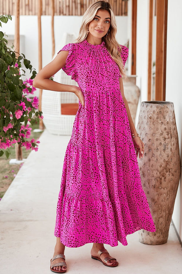 Rose Red Leopard Print Maxi Dress with ruffle sleeves, vibrant pattern, and flowing silhouette.