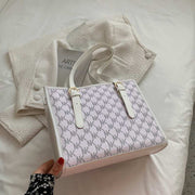 Elegant white large capacity handbag with patterned design and sturdy handles.