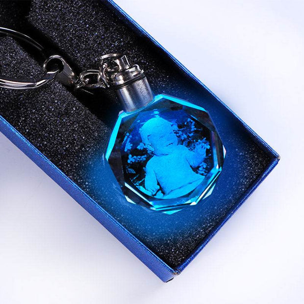 Crystal keychain with custom photo and blue LED light in gift box.