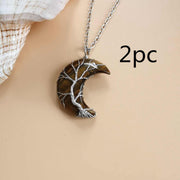 Moon Tree Of Life Necklace with crescent pendant and intricate tree design, symbolizing growth and connection.