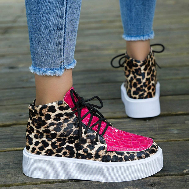Leather Leopard Platform Sneakers with bold leopard print and pink accents.