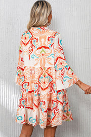 White Boho Print Mini Dress with colorful ethnic pattern and flowing fabric.