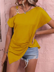 Women's off shoulder blouse in yellow with knot detail and denim shorts, showcasing chic style.