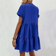 Fashionable short-sleeved V-neck dress in vibrant blue with a flowy skirt.