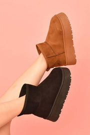 WILD DIVA Suede Platform Booties in brown and black, featuring chic platform sole and sleek silhouette for stylish comfort.