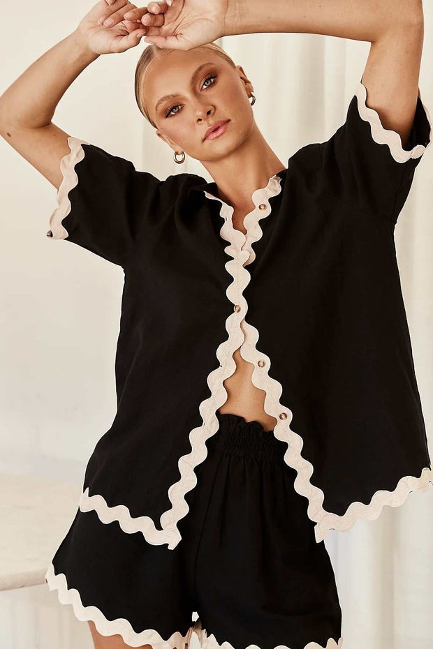 Stylish 2 Piece Summer Suit with scalloped edges, perfect for warm weather occasions.