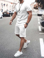 Plus size short sleeve top and shorts set in white, featuring crew neckline and relaxed fit, perfect for casual wear.