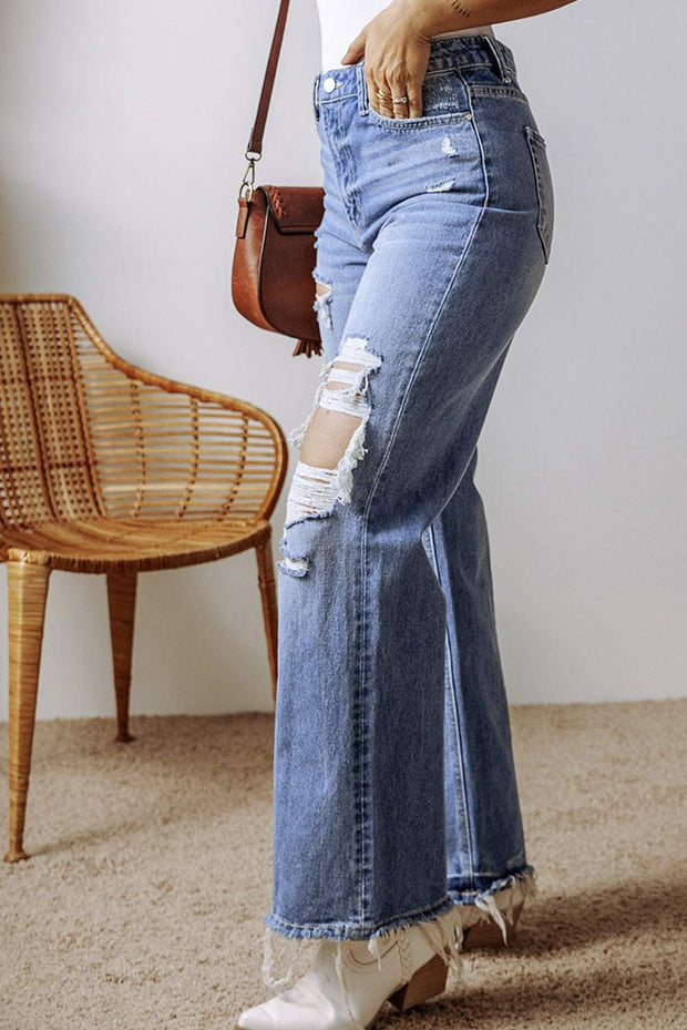 Sky blue distressed straight leg jeans with trendy rips and fading, providing a stylish and comfortable fit.