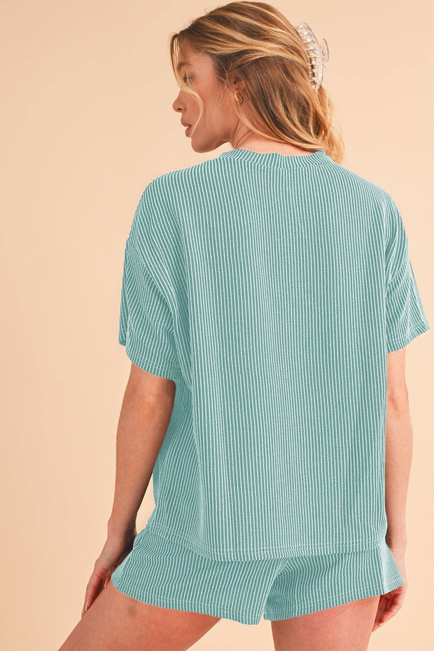 Orange ribbed tee and shorts set with a relaxed fit and vibrant color.