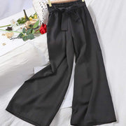 Elastic waist casual pants in black with wide-leg design.
