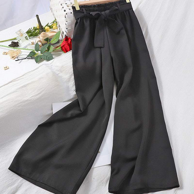 Elastic waist casual pants in black with wide-leg design.