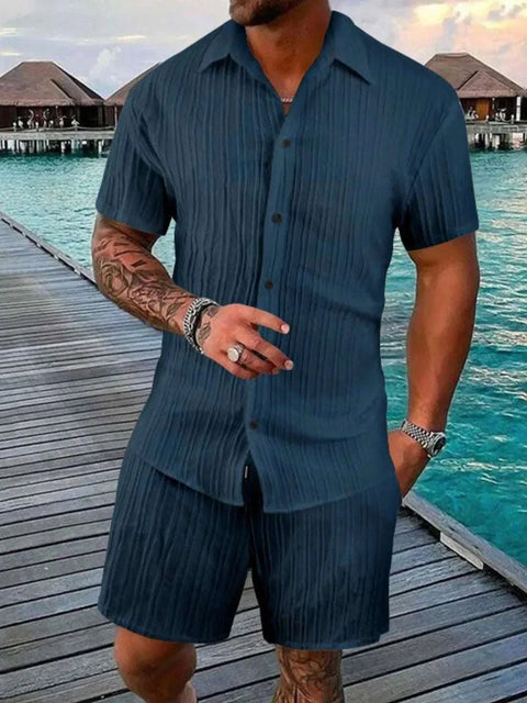Plus size navy blue button down shorts set with short-sleeve shirt and elastic waistband shorts.