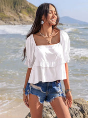 Ruffled square neck half sleeve blouse in white with delicate ruffles and elegant design.