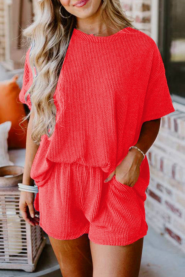Vibrant orange ribbed tee and shorts set for casual outings.