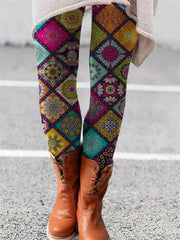 Colorful printed flared trousers with a geometric retro pattern.