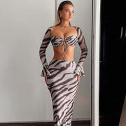 Printed long-sleeve slim skirt suit with zebra stripes pattern, sexy style, high-quality polyester fabric, figure-flattering fit.