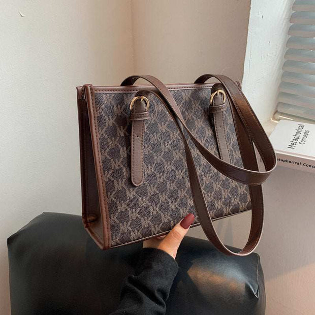 Large Capacity Handbag with stylish design and adjustable strap.