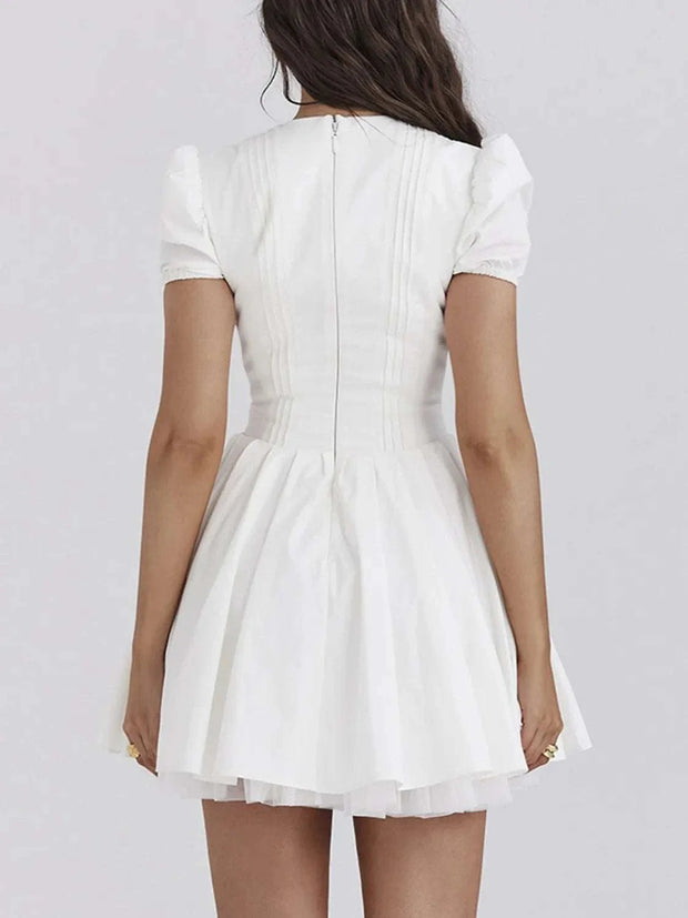 V-Neck Short Sleeve Mini Dress in white, featuring a fitted silhouette, short sleeves, and back zipper closure.