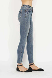 Tummy Control Vintage Skinny Jeans with high-rise waistband and distressed hem.
