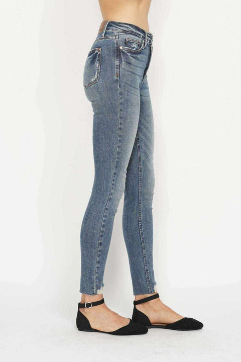 Tummy Control Vintage Skinny Jeans with high-rise waistband and distressed hem.