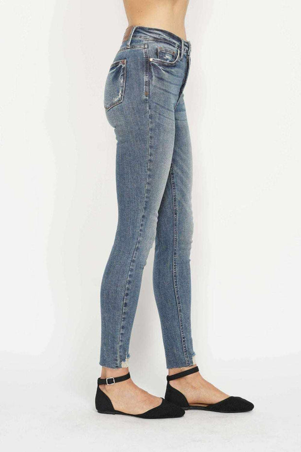 Tummy Control Vintage Skinny Jeans with high-rise waistband and distressed hem.