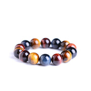 Tiger Eye Bracelet with polished natural stones in golden and brown hues for style and energy.