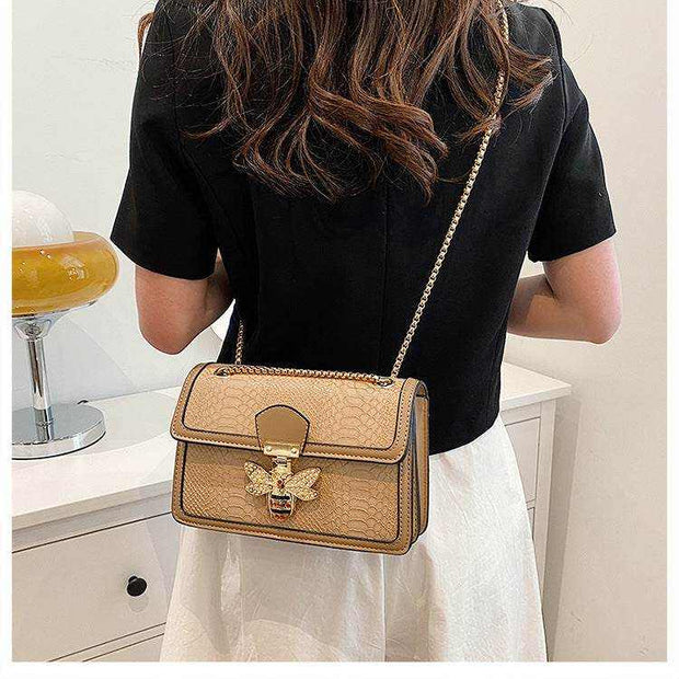 Chain shoulder bag with chic design and gold chain strap.
