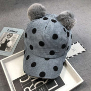 Ball Peaked Hat with double ball design, corduroy material, dot pattern, and adjustable strap for sun protection.