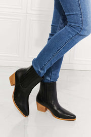 MMShoes Stacked Heel Chelsea Boot with block heel and pointed toe worn in blue jeans.