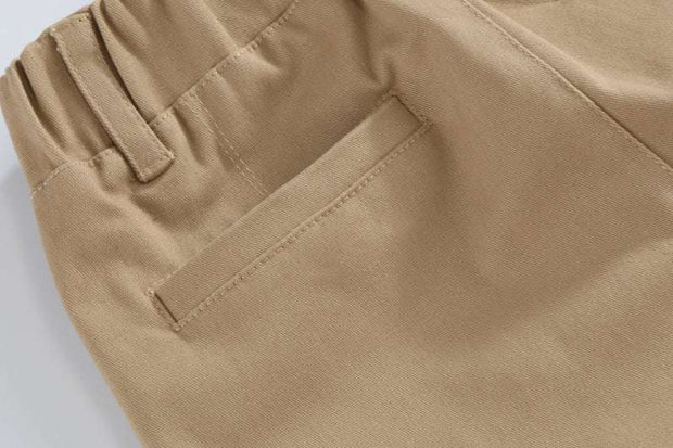 Close-up view of boys casual cotton trousers with pocket detail.
