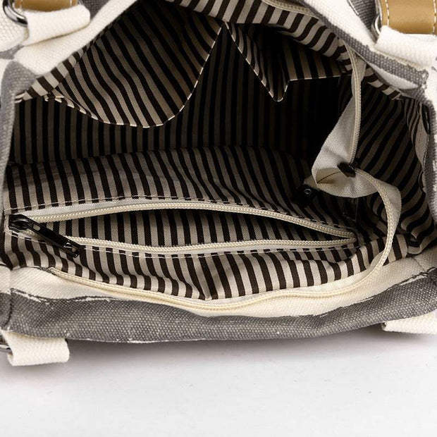 Spacious interior of the One-Shoulder Tote with striped lining and multiple compartments.