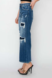 Risen Wide Leg Crop Jeans in blue denim with patch detailing, high-rise fit, and cropped length showcasing heels.