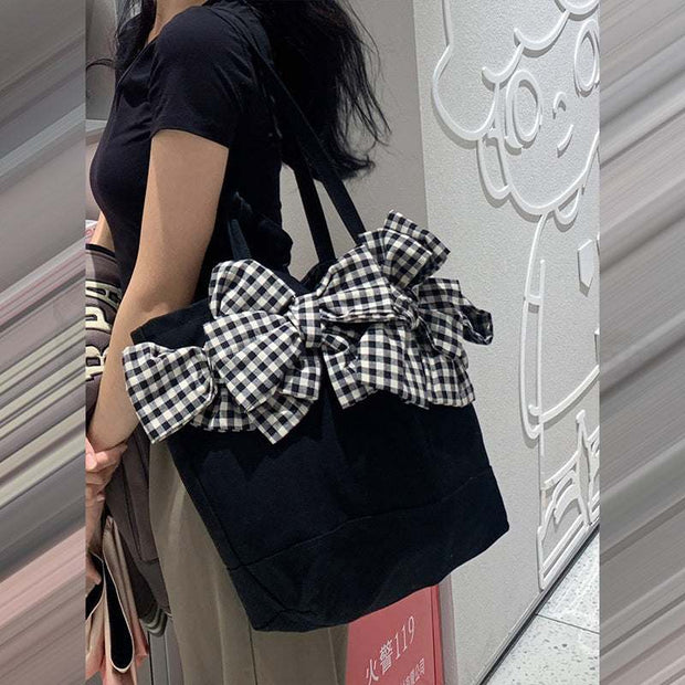 Big Bow Crossbody Bag with oversized checkered bow and adjustable strap, stylish and functional accessory.