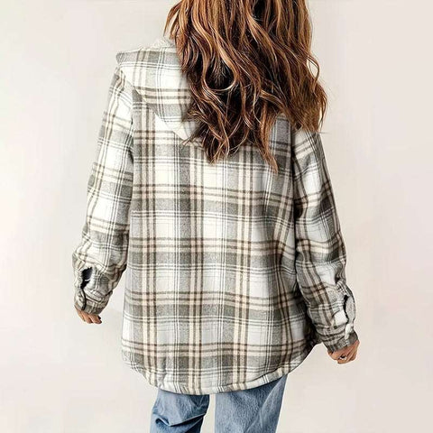 Back view of woman wearing beige and white plaid hooded fleece-lined jacket with casual jeans
