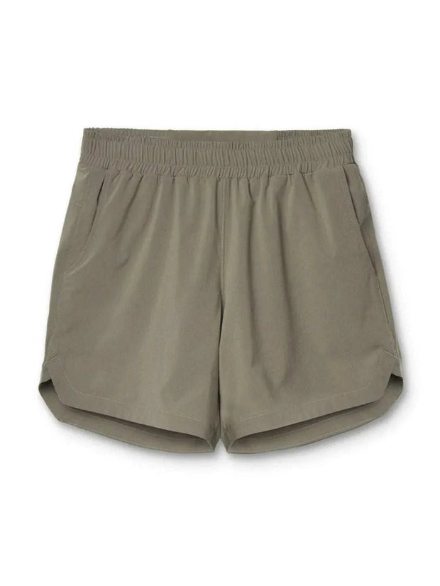 Elastic Waist Active Shorts in beige with pockets, perfect for workouts.
