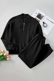 Quarter Zip Top and Pants Set in black, featuring a long sleeve top with zip neckline and matching pants, made from soft, breathable fabric.