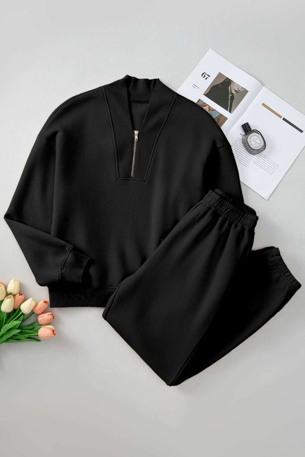 Quarter Zip Top and Pants Set in black, featuring a long sleeve top with zip neckline and matching pants, made from soft, breathable fabric.