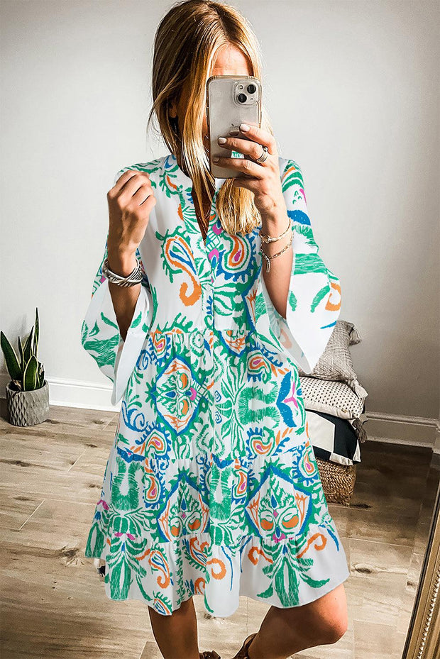 White Boho Print Mini Dress with playful bohemian style and vibrant pattern.