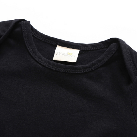 Batman Baby Onesie with soft black cotton fabric and branded tag.