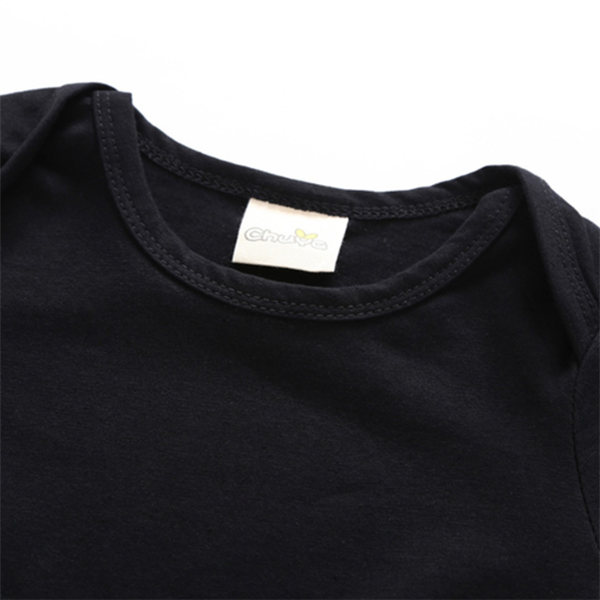 Batman Baby Onesie with soft black cotton fabric and branded tag.