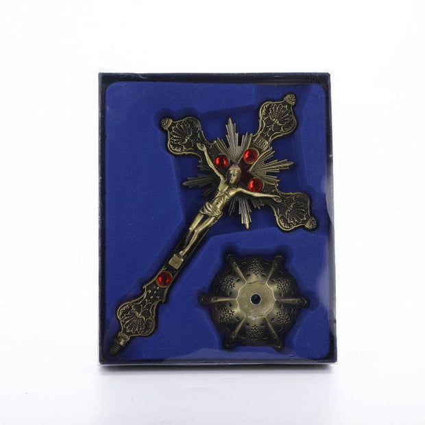 Religious Cross Ornament with ornate gold design and red accents in decorative packaging.