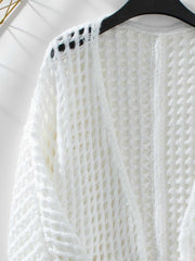 Open Front Openwork Cardigan with intricate knit design on hanger.