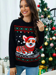 Woman wearing black Christmas round neck sweater with festive Corgi and holiday patterns in front of decorated Christmas tree
