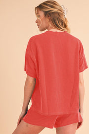 Orange ribbed tee and shorts set for casual wear.