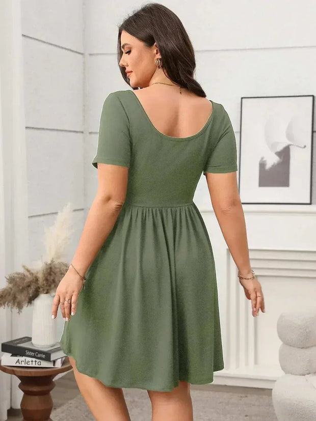 Plus size square-neck short-sleeve mini dress in olive green, showcasing back view with flattering fit.
